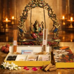 Premium incense gift box hamper with agarbatti, dhoop sticks, cones and cup sambarani placed in front of Lord Ganesha for pooja
